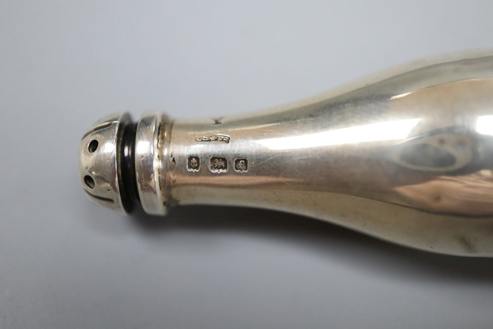 An Edwardian novelty silver pepperette, modelled as a Champagne bottle, Saunders & Shepherd, Birmingham, 1905,